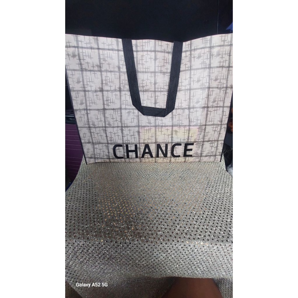 Shop in style with this reusable Beige & Black Chance Tote Bag 16x14